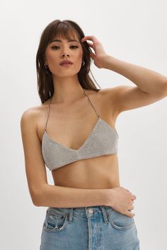 Channeling the glitz of the early aughts, this rhinestone mesh bra is covered in shimmering rhinestones with delicate straps and is fully lined with faux leather for added comfort. Pair with the matching skirt to complete the look. Silver Bralette, Crystal Bralette, Mesh Bra, Faux Leather Fabric, Bralette Tops, Leather Fabric, Female Portrait, Bralette, Faux Leather