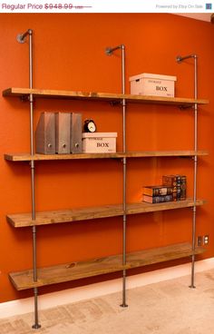 an orange wall with some shelves on it