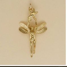 Gold Plated Fairy with Star Charm Pendant 1 1/4 inch, 31mm (Chain not included, for illustration only) LIFETIME REPLACEMENT GUARANTEE We will replace your item if it breaks during normal wear GOLD PLATING GUARANTEE If, in the rare event, the gold plating wears off, we will re-plate it for free The gold plating is 22 Karat over 925 sterling silver. Sterling Silver Chains ... https://www.etsy.com/listing/1340663831/sterling-silver-rope-chain-drawn-flat Gold Filled Chains ...  https://www.etsy.com/listing/1328079176/gold-filled-rope-chain-drawn-flat-cable CHAINS ARE NOT RETURNABLE EARRINGS Checkout 2 charms to place an order for a pair of earrings.  Message me at checkout that you would like earrings, or via Etsy convo after checkout.  There is a $4 re-stocking fee for returned earrings. Silver Fairy, Diy Jewelry Rings, Fairy Charms, Silver Chains, Jewelry Lookbook, Fantasy Jewelry, Jewelry Inspo, Boyfriend Girlfriend, Pretty Jewellery