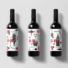 three bottles of red wine on a white background with the label in black and red