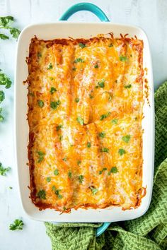 an enchilada casserole with cheese and parsley