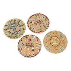 three decorative coasters with the words love and peace written in different languages on them