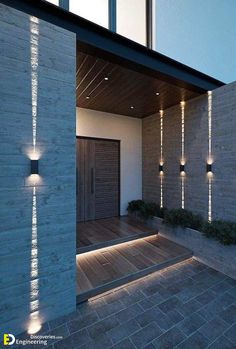 an outdoor area with some lights on the wall