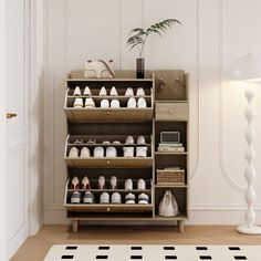 a shoe rack with many pairs of shoes on it and a lamp next to it