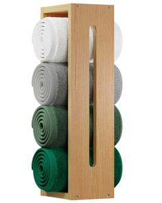 an open wooden box filled with lots of different colored rolled up towels on top of each other