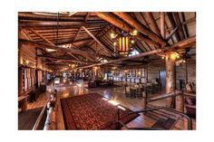 the inside of a building with wooden floors and ceilings