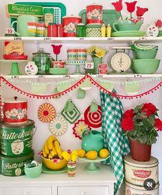 a shelf filled with lots of green and red items