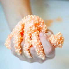 a person holding some kind of coral in their hand