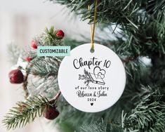 a personalized ornament hanging on a christmas tree with the name and date