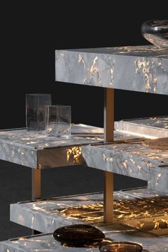 an artistic display with marble and gold accents