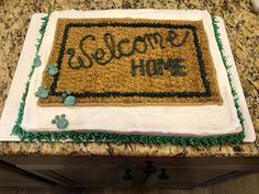 a welcome home cake on a granite countertop