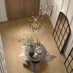 a table with two vases on top of it next to a mirror and door