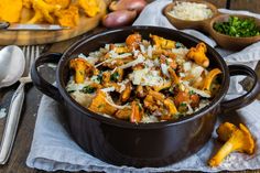 a pot full of food sitting on top of a table