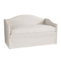 a white daybed with a pillow on it's back and the seat upholstered