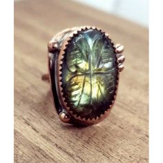 This One Of A Kind Ring Was Crafted From A Rectangular Cabochon Of A Rainbow Butterfly Carved Labradorite Crystal Gemstone That Gives Off Some Nice Gray, Green,Blue And Orange Inclusions Depending On The Lighting And Angle. The Stone Has Been Metalworked In Copper And With Lead Free, Silver Bearing Solder To A Size 6 Ring Base. This Ominous Beauty Definitely Looks Like What A Vampire Or Monster Lover Would Wear. Great Ring For The Biker In Your Family. Love The Gothic Detail And Uniqueness Of The Labradorite. Amazing Design And Stone. Goes With With Any Outfit Or As A One Of A Kind Gift. Please Contact Me With Any Questions. Monster Lover, Butterfly Rainbow, Rainbow Butterfly, The Gothic, Labradorite Crystal, Rainbow Crystal, Copper Rings, Blue And Orange, Gray Green