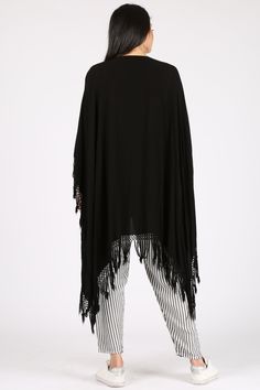 A light take on the poncho, this versatile piece can also act as a shawl and beach coverup. Please note this style is unisex. Fabric Content: 60% Cotton, 40% Rayon, made in Morocco. Sizing: O/S