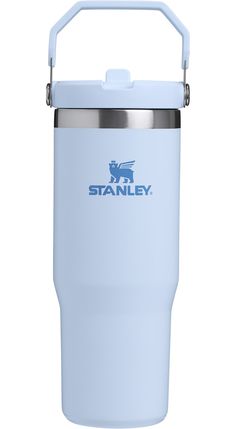 the stanley stainless steel insulated travel mug is light blue and features an insulated handle