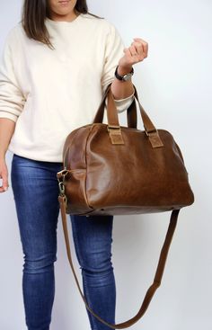 Brown Large Bag, Duffel Bag, Leather Travel Bag Dimensions: height: 30 cm (12 in) width at the base: 47 cm (18.5 in) width at the top: 39 cm (15.5 in) depth: 17 cm (6.7 inch) handle strap drop: 19 cm (7.5 inch) long strap: 122 cm (48 inch) This Unisex bag is perfect as a travel bag, for a stylish weekend, overnight bag or gym bag. Beautiful vegetable tanned leather makes this bag an unique gift for your beloved one. The bag is made from top quality leather. Thanks to solid brass hardware and lea Everyday Satchel Travel Bag With Adjustable Handle, Large Capacity Duffle Bag Satchel For Daily Use, Large Capacity Duffle Bag For Daily Use, Rectangular Travel Bag With Adjustable Handle For Everyday, Weekender Satchel Bag With Adjustable Handle For On-the-go, On-the-go Travel Bag Satchel With Adjustable Handle, Everyday Large Capacity Satchel Duffle Bag, Everyday Satchel Duffle Bag, Everyday Duffle Bag With Adjustable Handle In Satchel Shape