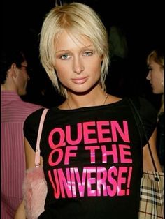 a woman with blonde hair wearing a t - shirt that says queen of the universe