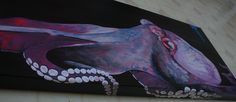 an octopus painted on the side of a wall next to a wooden floor with white dots