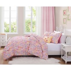 a bedroom with pink and yellow bedding, white nightstands, and window curtains