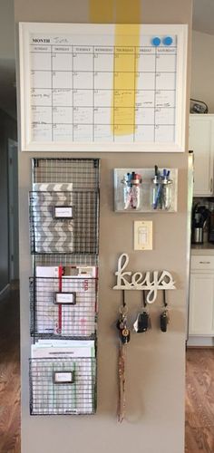 a refrigerator with several baskets and magnets on it