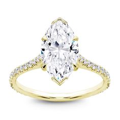 a yellow gold engagement ring with an oval cut diamond