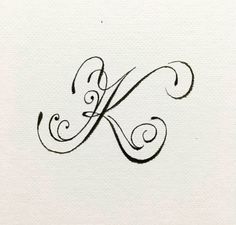 the letter k is made up of swirly black ink and has an elegant design