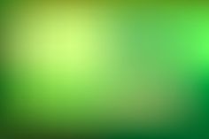 a blurry image of green and yellow colors