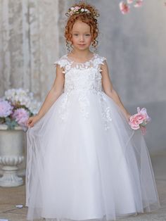 Ivory Princess Gown with Lace Appliques and Tulle Bow | Short Sleeve Ankle-Length Tulle Flower Girl Dress Blushing Pink / 11y Product Code: 226439         Embellishment: Lace,Bow,Flower,Appliques Lace             Fabric: Tulle             Silhouette: Ball-Gown/Princess             Neckline: Square Neck             Sleeve: Short Sleeves             Hemline/Train: Ankle-length             Back Style: V Back,Covered Button White Tulle Dress With Illusion Neckline, First Communion Gown With Tulle Skirt, White Tulle Dress With Floral Applique, Tulle Dress With Fitted Bodice For Confirmation, White Tulle Princess Dress With Floral Applique, White Princess Dress With Floral Applique In Tulle, White Tulle Ball Gown Tutu Dress, Fitted Tulle Gown For Confirmation, Tulle First Communion Dress Ball Gown