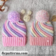 two knitted hats sitting next to each other