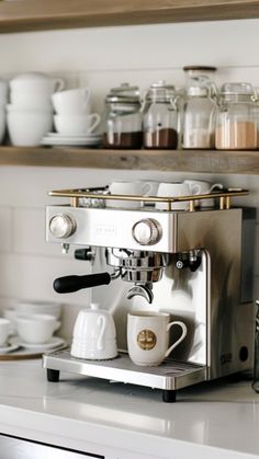 an espresso machine sitting on top of a counter