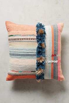 a pillow with tassels on it and the caption reads, top rated