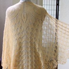 a woman's shawl is shown on a mannequin