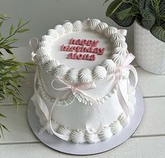 a birthday cake with the words happy birthday mom written on it and decorated with seashells