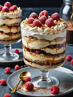 two desserts with raspberries and whipped cream