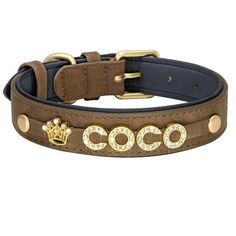 a dog collar with the word coco written on it and gold hardwares around the collar