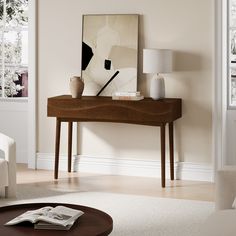 a living room scene with focus on the coffee table and magazine rack in the foreground