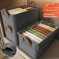 two storage bins with handles are shown in this image, one is open and the other has folded fabric