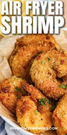 fried shrimp is served in a basket with parsley on top and the caption reads, fish fry shrimp