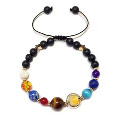 PRICES MAY VARY. This bracelet is handmade from natural stones, which contains NINE different colors of stones, corresponding to the NINE planets in solar system. Unique Design:This is the coolest bracelet for people who likes astronomy! The beads represent the nine planets : Mercury, Venus, Earth, Mars, Jupiter, Saturn, Neptune, Uranus and Pluto. Those small black Lava stones represent the black hole in the outer space. This bracelet has two styles, one is with elastic string, another is woven Planets In The Solar System, Star Bracelets, Eight Planets, Nine Planets, Planets And Moons, You Are The Sun, Universe Galaxy, The Solar System, Natural Stone Bracelets