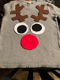 a sweater with reindeer's eyes and nose on it