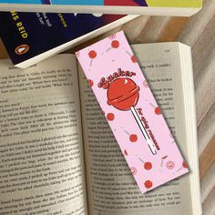 the bookmark is laying on top of an open book