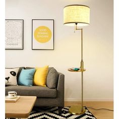 a living room scene with focus on the floor lamp and sofa in the foreground