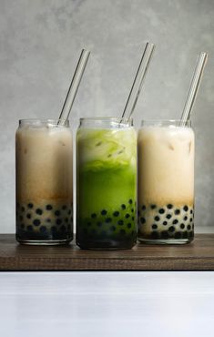 three glasses with different types of drinks in them