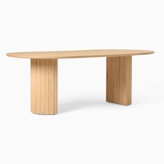 an oval wooden table with curved legs and wood grained finish, on a white background