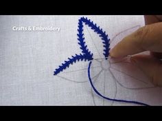 someone is working on something with blue thread