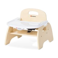 a wooden high chair with a white tray on the back and seat up to it's side