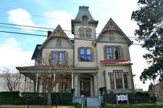 an old victorian style house with many windows