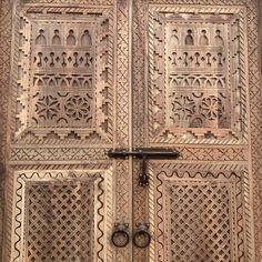 an old wooden door with intricate carvings on it